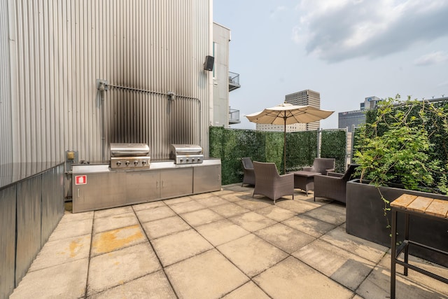 view of patio with an outdoor living space, an outdoor kitchen, and area for grilling