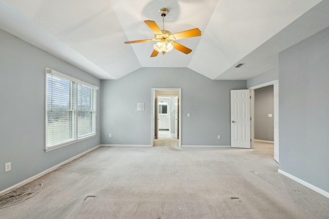 unfurnished bedroom with lofted ceiling, light colored carpet, and ceiling fan