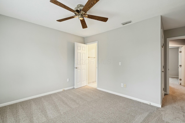 empty room with light carpet and ceiling fan