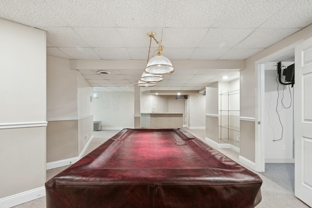 playroom with a drop ceiling and light carpet