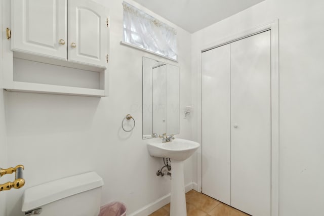 bathroom with sink, tile patterned floors, and toilet