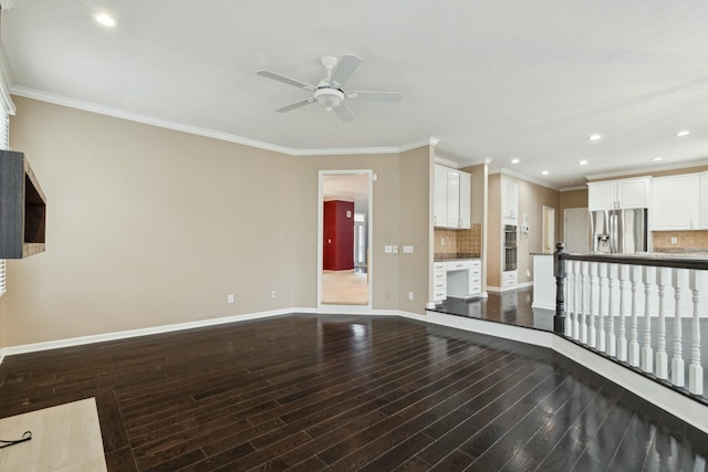 unfurnished living room featuring ornamental molding, hardwood / wood-style floors, and ceiling fan