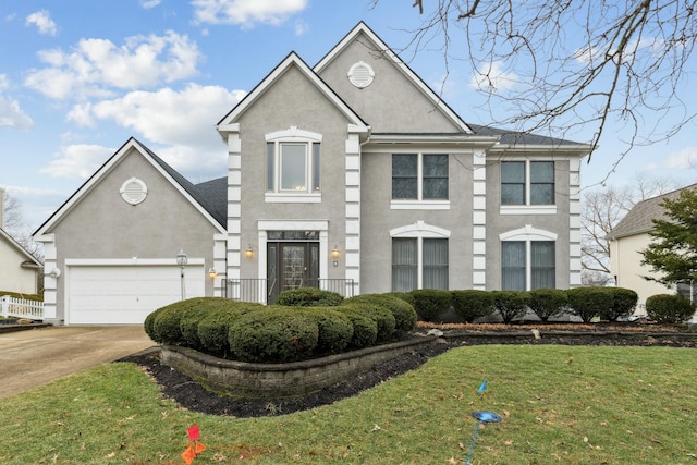 view of front of house with a garage and a front lawn