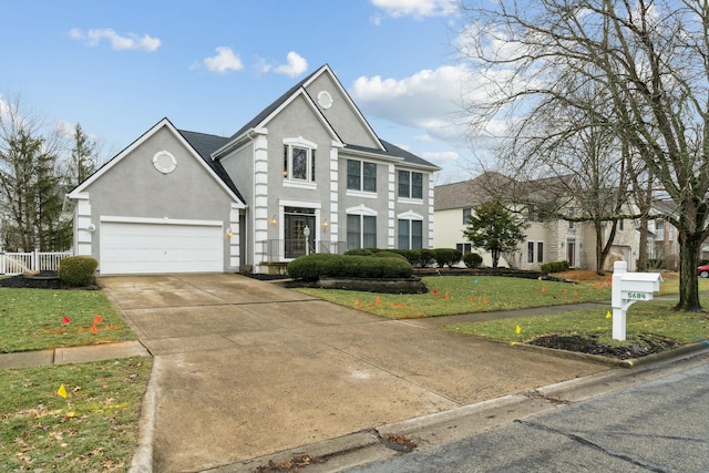 view of front of home featuring a garage and a front lawn