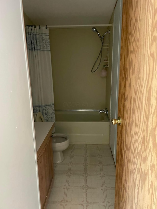 full bathroom featuring vanity, shower / bath combination with curtain, and toilet