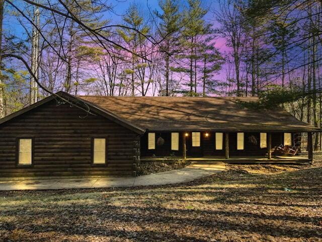 view of property exterior at dusk