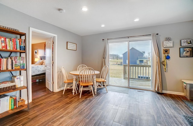 dining room featuring dark hardwood / wood-style flooring