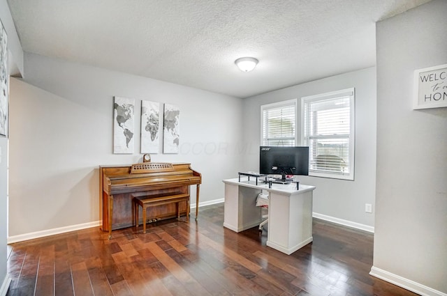 office space featuring dark hardwood / wood-style flooring and a textured ceiling