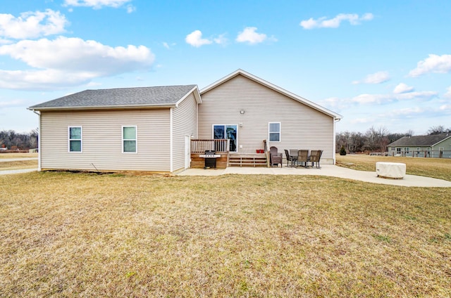 rear view of house with a yard and a patio area