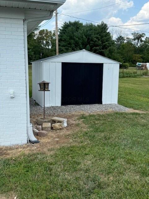 view of outbuilding with a yard