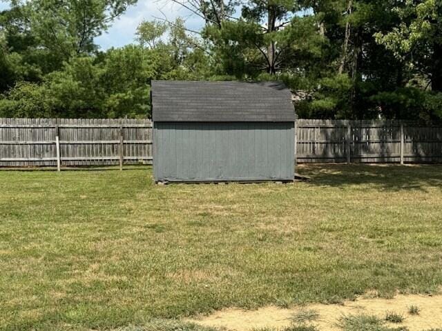 view of outdoor structure featuring a lawn