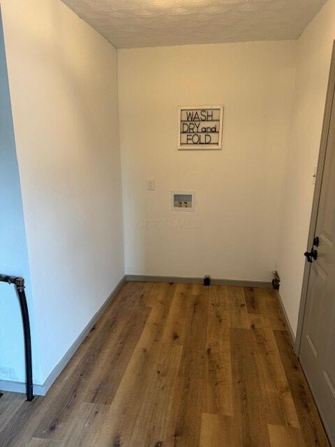 laundry room featuring hookup for a washing machine and hardwood / wood-style floors