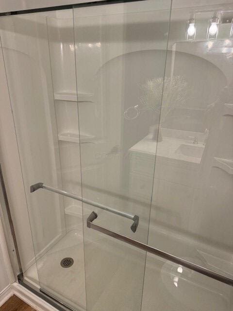 bathroom with a shower with shower door