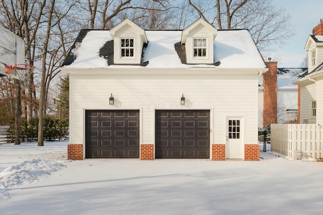 view of snow covered garage