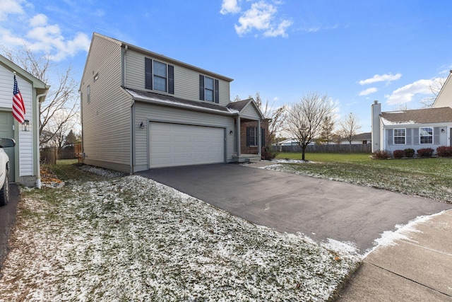 view of front property with a garage and a front lawn