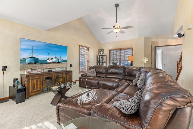 living room featuring ceiling fan, carpet floors, and high vaulted ceiling