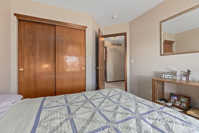 bedroom with carpet and a closet