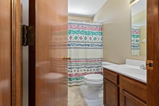 bathroom with vanity, toilet, and a shower with shower curtain