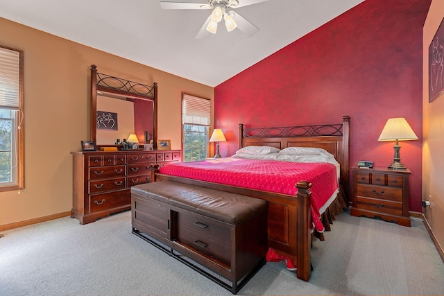 carpeted bedroom featuring vaulted ceiling and ceiling fan