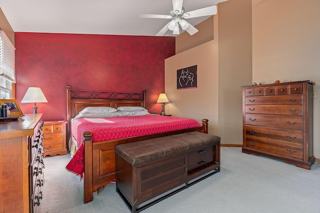 bedroom with ceiling fan and light carpet