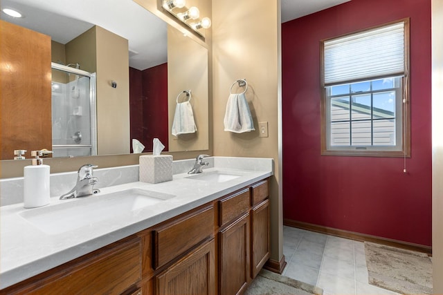 bathroom with walk in shower, tile patterned floors, and vanity