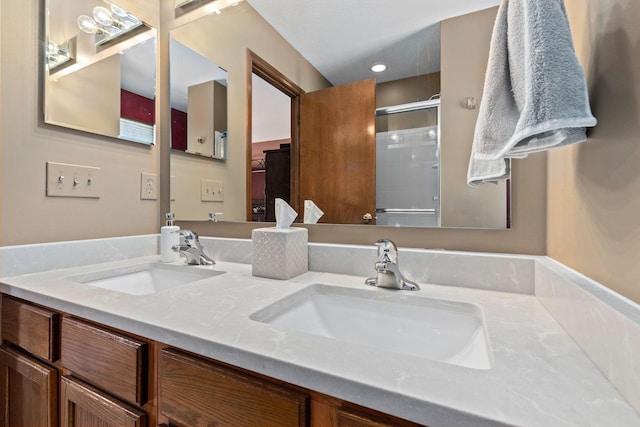 bathroom with vanity and an enclosed shower