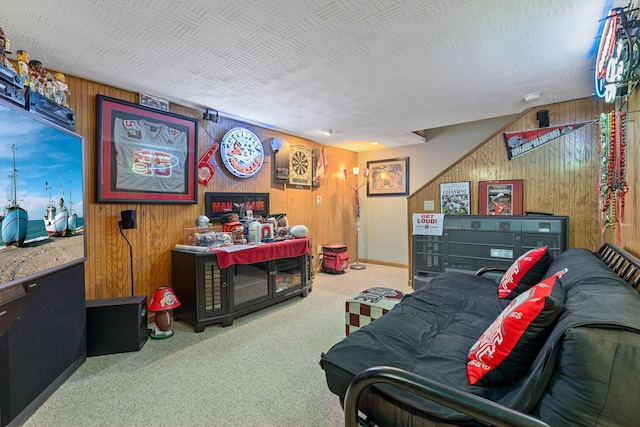 playroom with light carpet and wooden walls