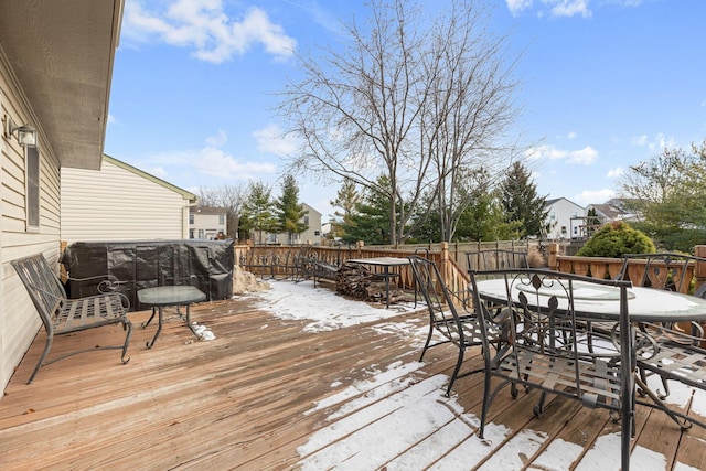 view of snow covered deck