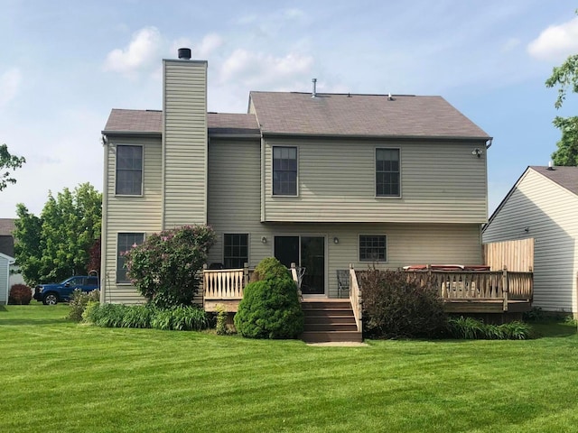5037 Langcroft Dr, Hilliard, OH 43026 - rear view of property with a lawn, a wooden deck, and a chimney