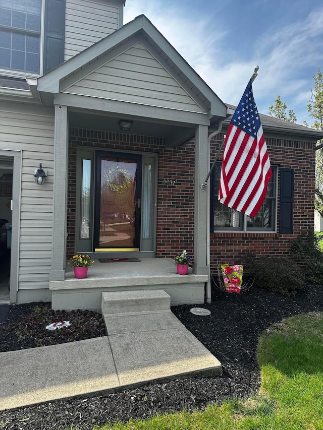 5037 Langcroft Dr, Hilliard, OH 43026 - doorway to property with brick siding