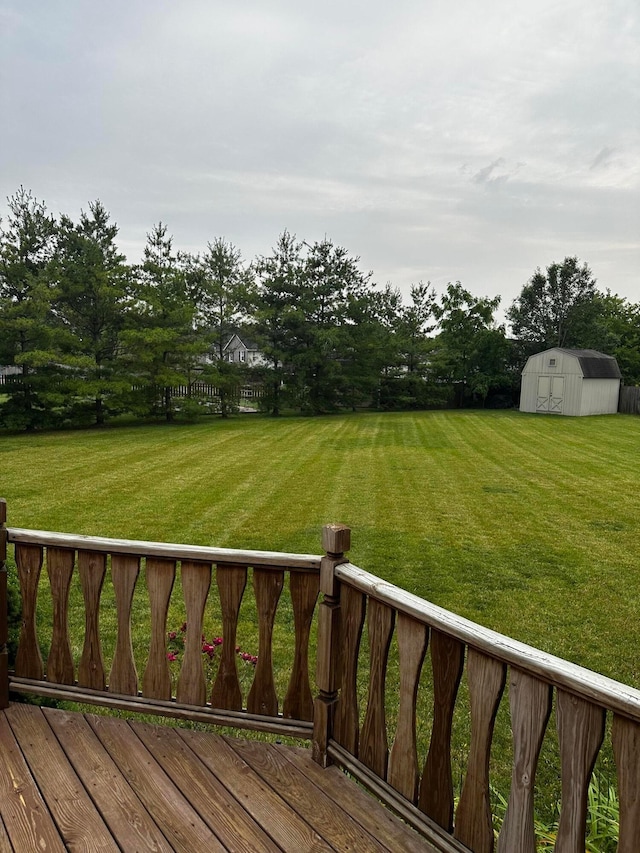 5037 Langcroft Dr, Hilliard, OH 43026 - wooden deck featuring a storage shed and a lawn