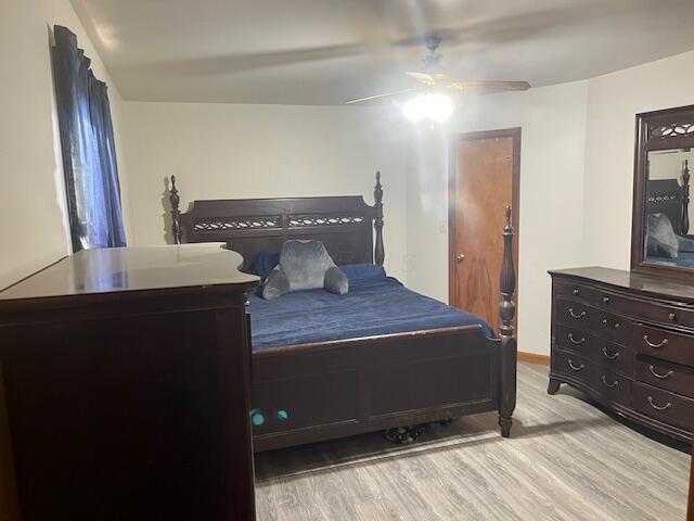 bedroom featuring ceiling fan and light hardwood / wood-style flooring