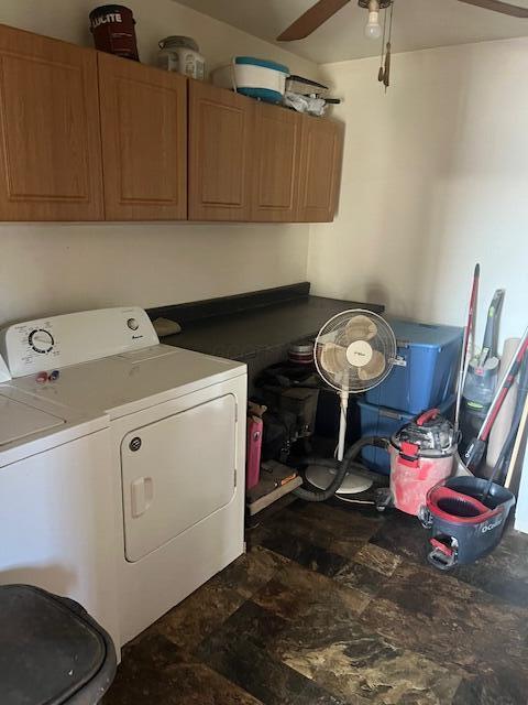 laundry area with ceiling fan, cabinets, and washer and clothes dryer