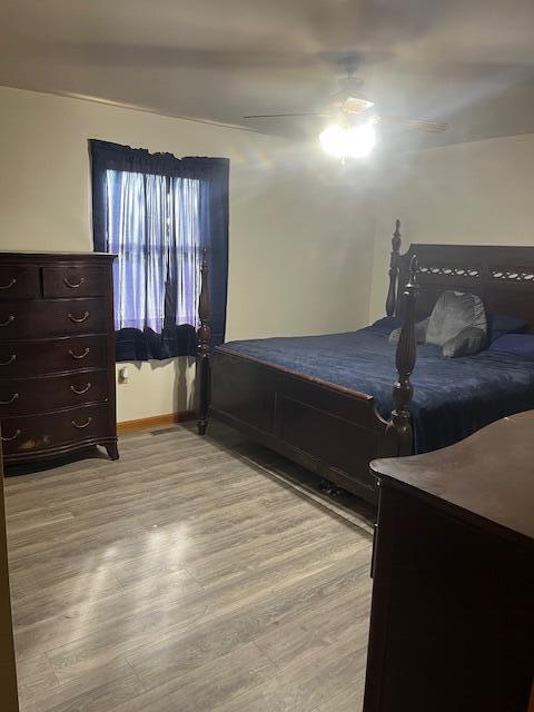 bedroom featuring ceiling fan and light wood-type flooring