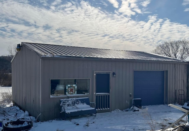 view of snow covered garage