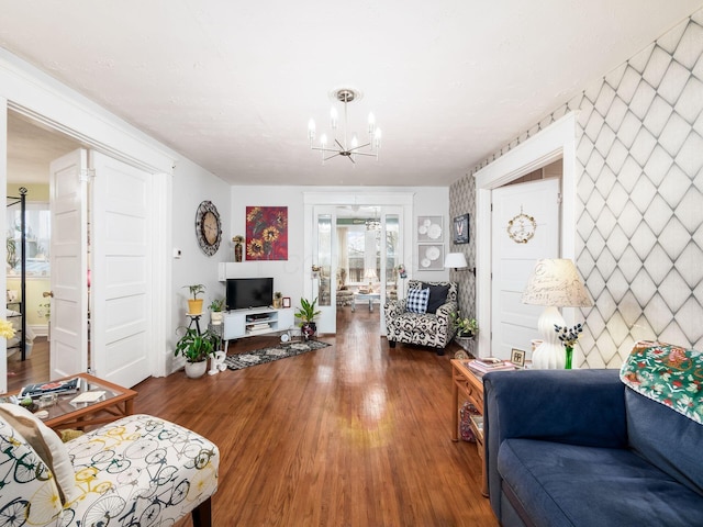 living room with hardwood / wood-style flooring and a chandelier