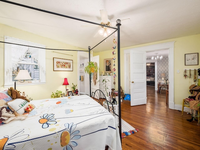 bedroom featuring dark hardwood / wood-style floors and ceiling fan