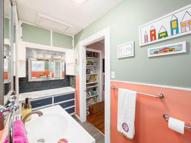 bathroom with vanity and hardwood / wood-style floors