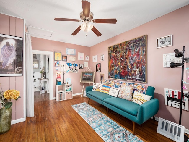 living room featuring hardwood / wood-style flooring and ceiling fan