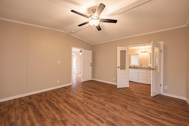 unfurnished bedroom with dark hardwood / wood-style flooring, crown molding, lofted ceiling with beams, and a textured ceiling