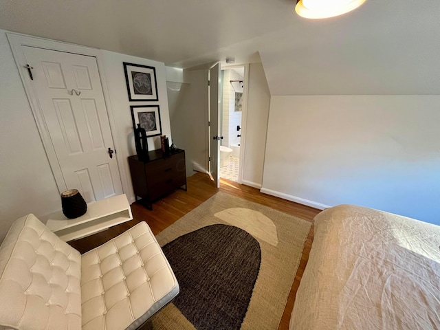 living area featuring lofted ceiling and wood-type flooring