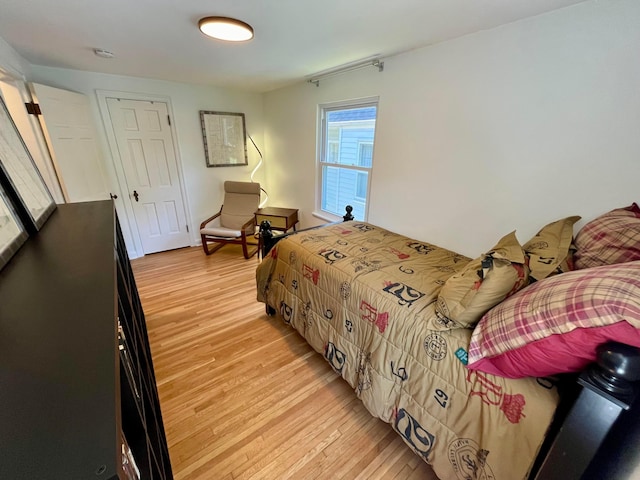 bedroom with light hardwood / wood-style flooring