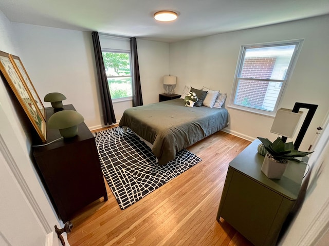 bedroom with light wood-type flooring