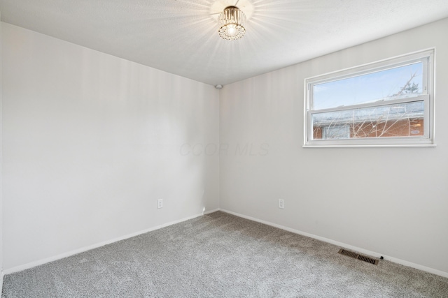 spare room with carpet flooring