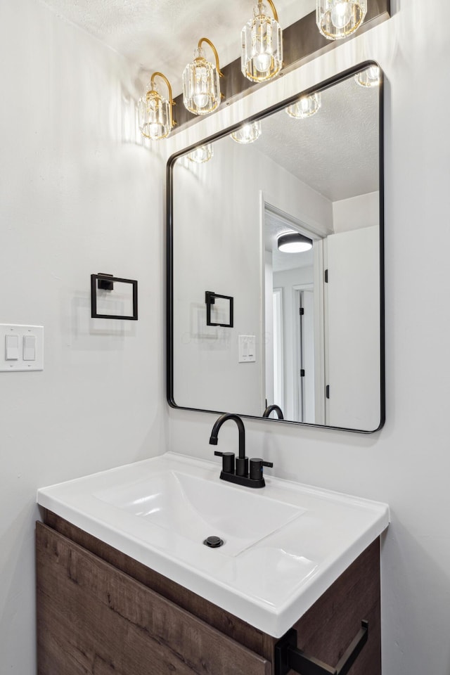 bathroom featuring vanity and a textured ceiling