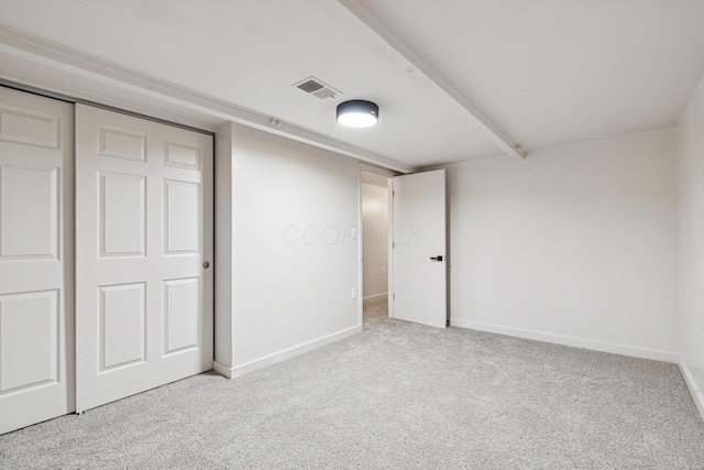 unfurnished bedroom featuring light colored carpet