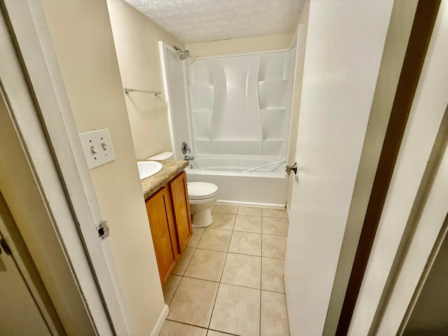 full bathroom featuring vanity, a textured ceiling, toilet, and tile patterned flooring