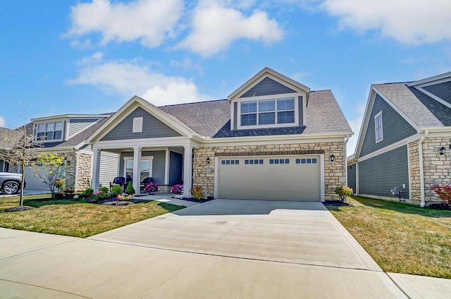 view of front of house with a porch, a garage, and a front yard