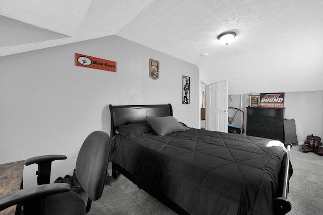 carpeted bedroom featuring vaulted ceiling and a textured ceiling