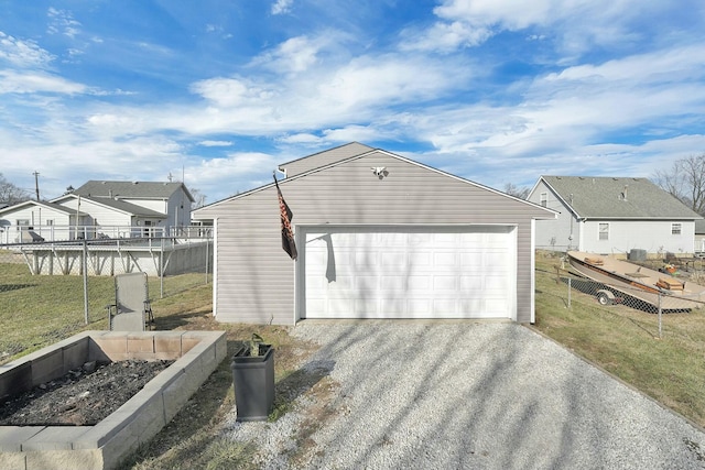 view of property exterior featuring a yard, a garage, and an outdoor structure